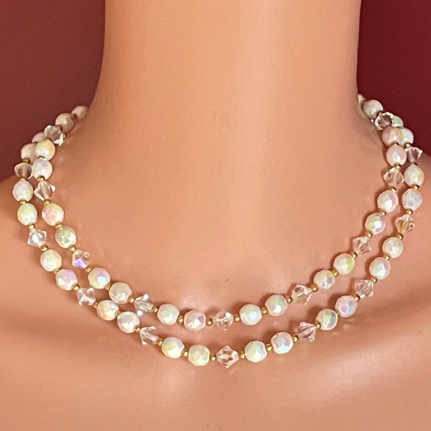 Model wearing 1950s double strand milk glass and crystal necklace