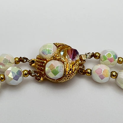 Close-up of ornate goldtone box clasp with coordinating bead accents