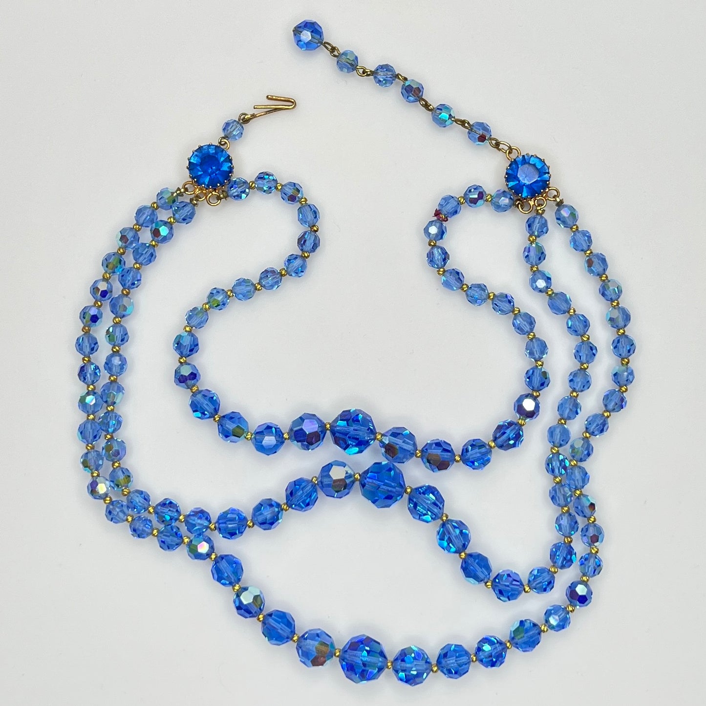 Faceted blue crystal bead necklace with jeweled hook clasp and extender