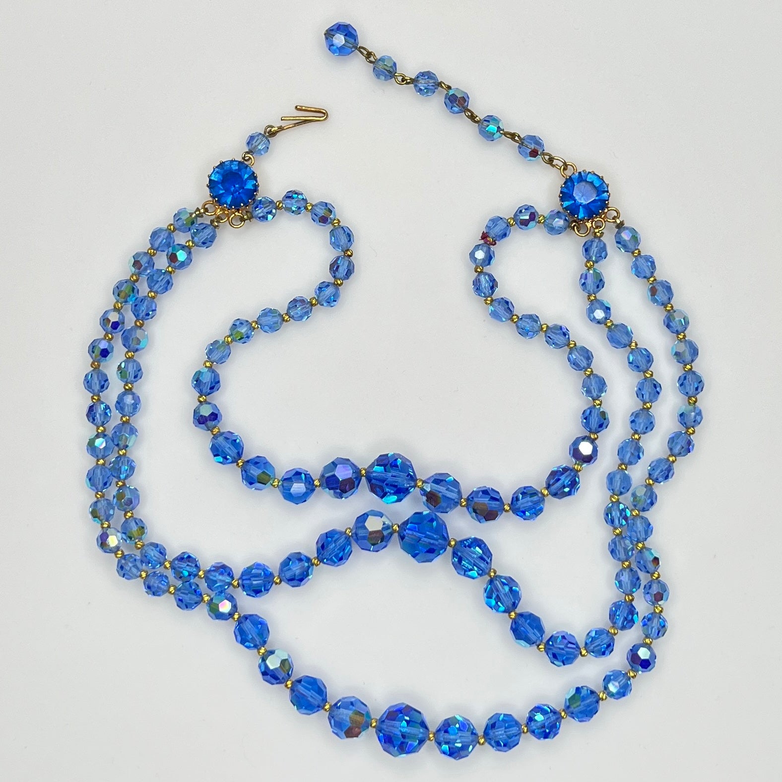 Faceted blue crystal bead necklace with jeweled hook clasp and extender