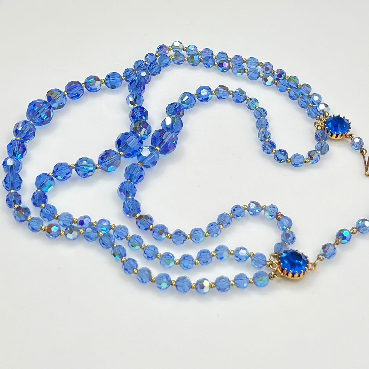 Faceted blue crystal bead necklace with jeweled hook clasp and extender