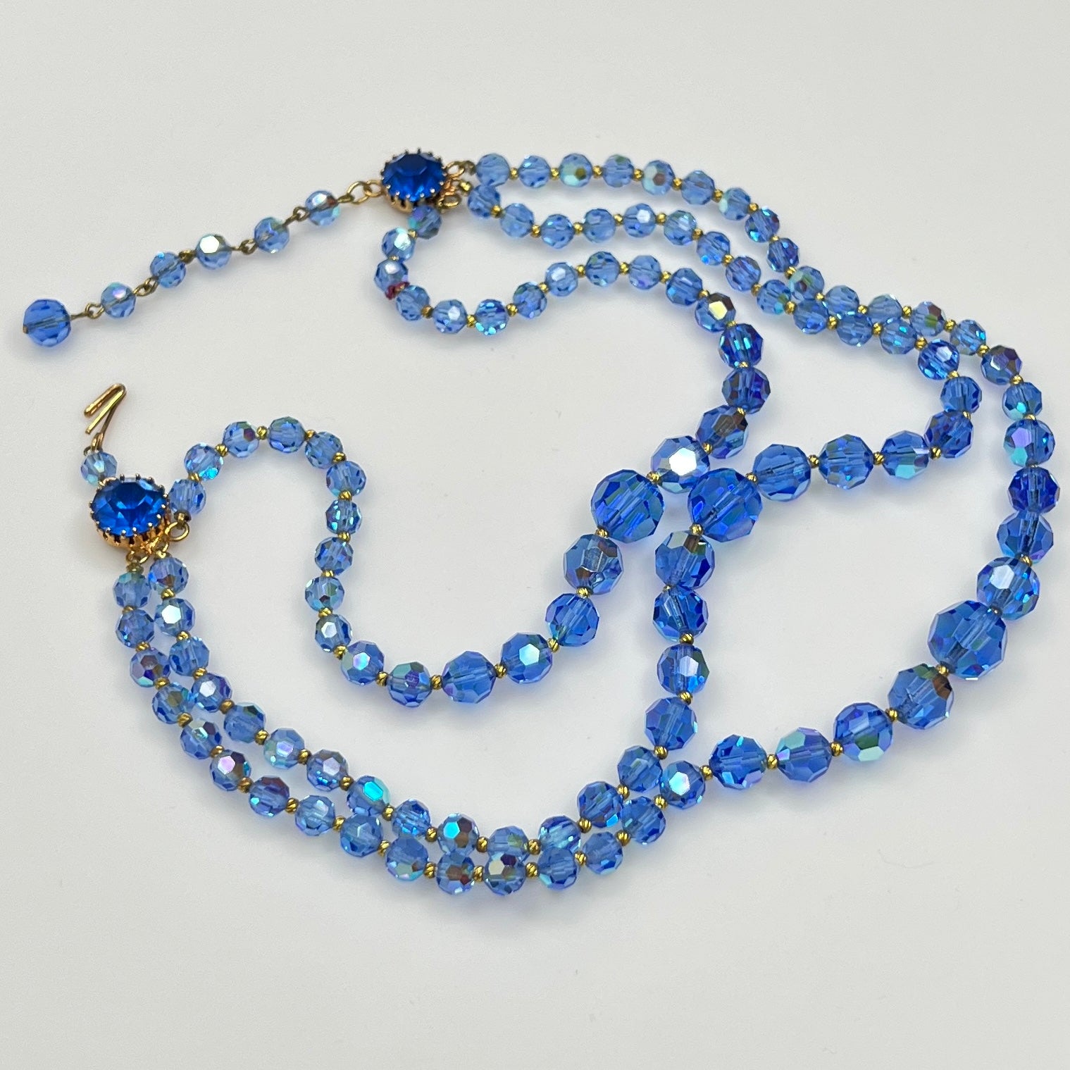 Faceted blue crystal bead necklace with jeweled hook clasp and extender