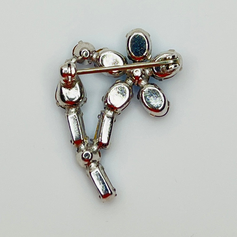Back view of 1950s rhinestone brooch with silver-tone setting and clasp