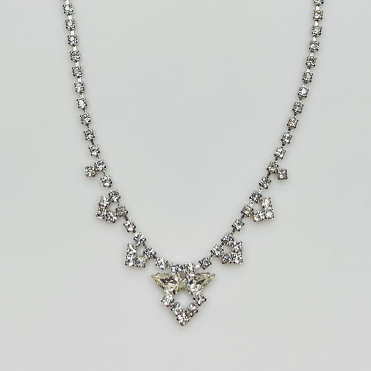 Full view of crystal necklace with prong-set rhinestones on white background