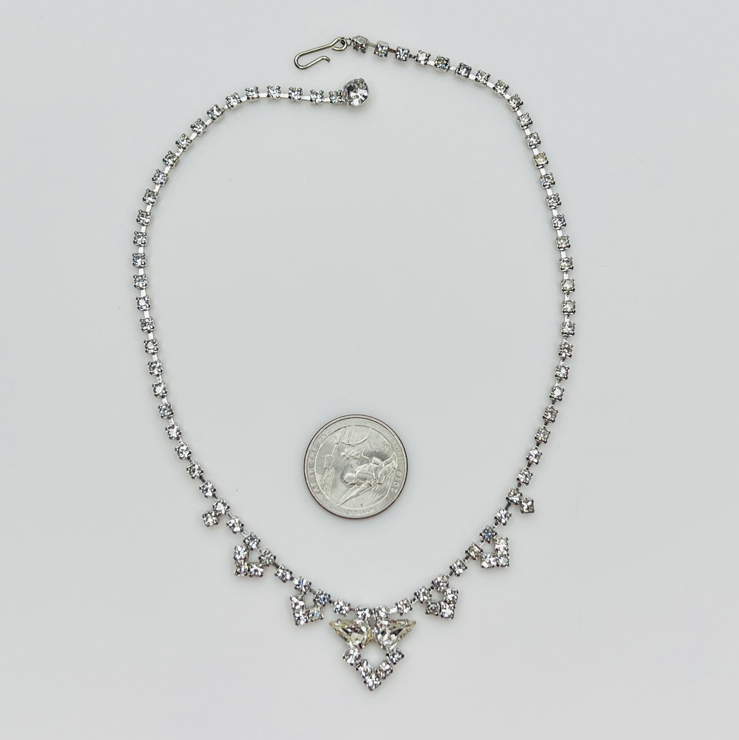 Necklace laid flat showing hook clasp and rhinestone extender