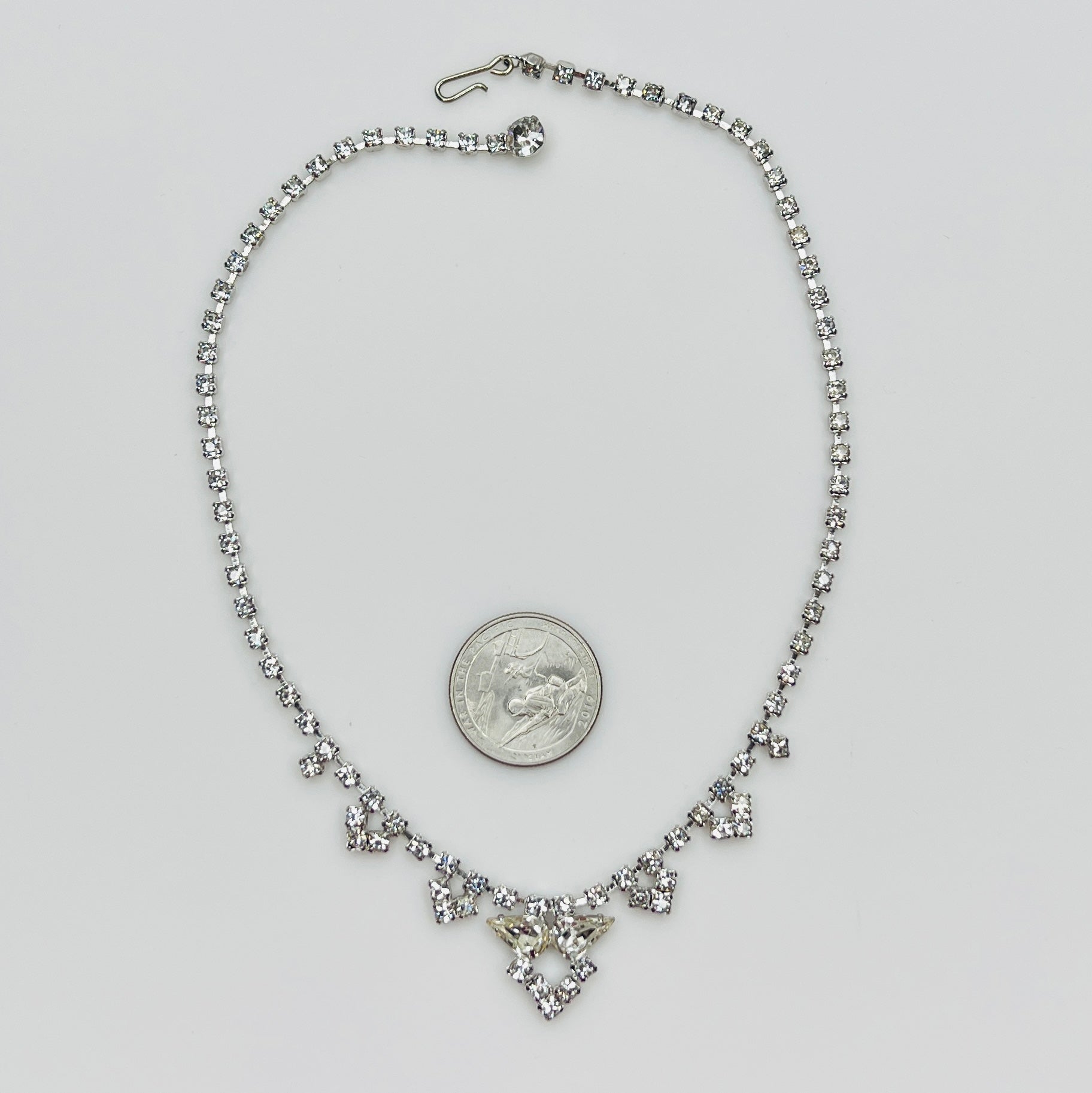 Necklace laid flat showing hook clasp and rhinestone extender