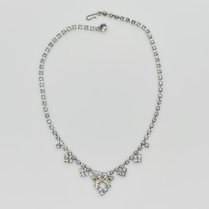 Necklace laid flat showing hook clasp and rhinestone extender