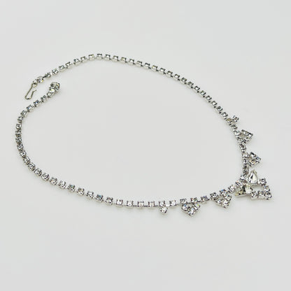 Necklace laid flat showing hook clasp and rhinestone extender