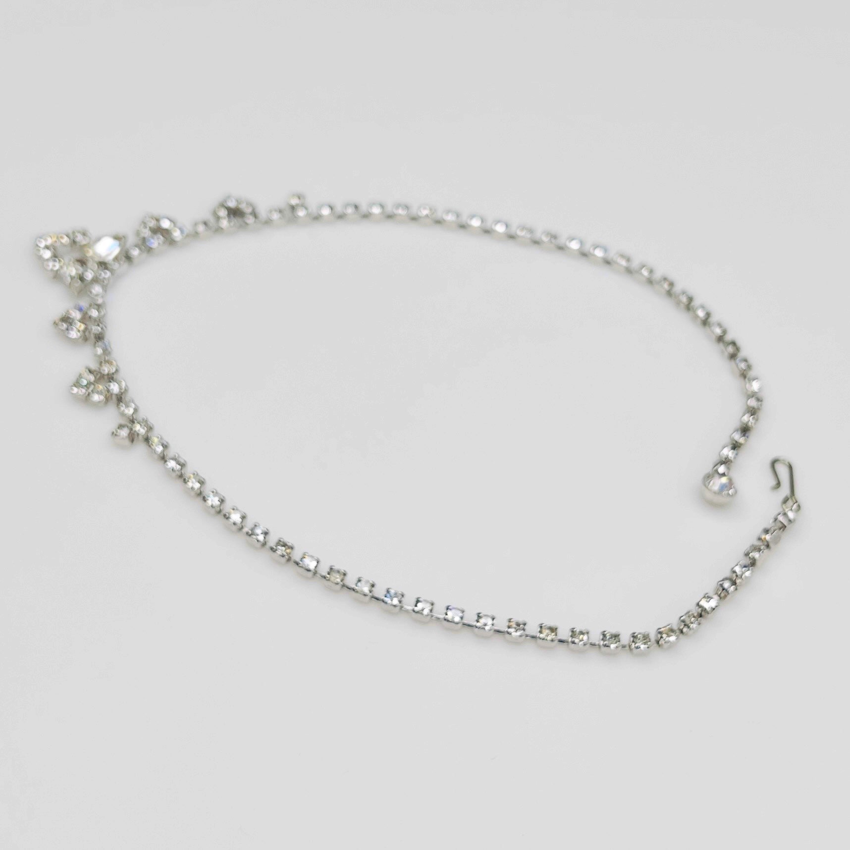 Necklace laid flat showing hook clasp and rhinestone extender