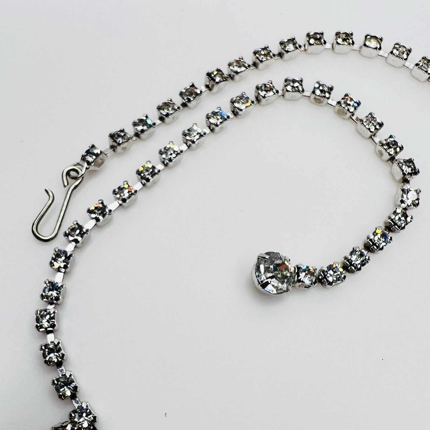 Necklace laid flat showing hook clasp and rhinestone extender