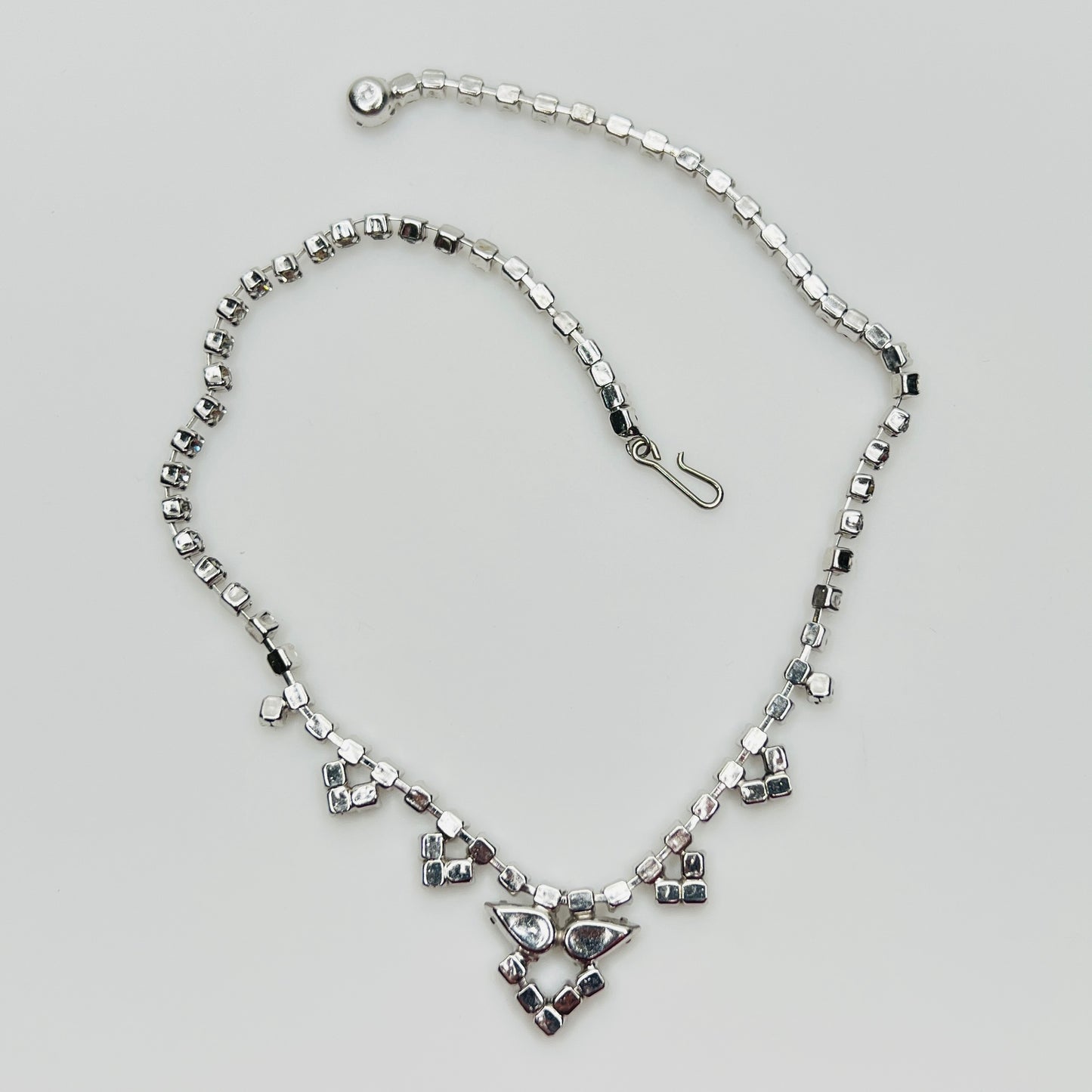back view of Necklace laid flat showing hook clasp and rhinestone extender