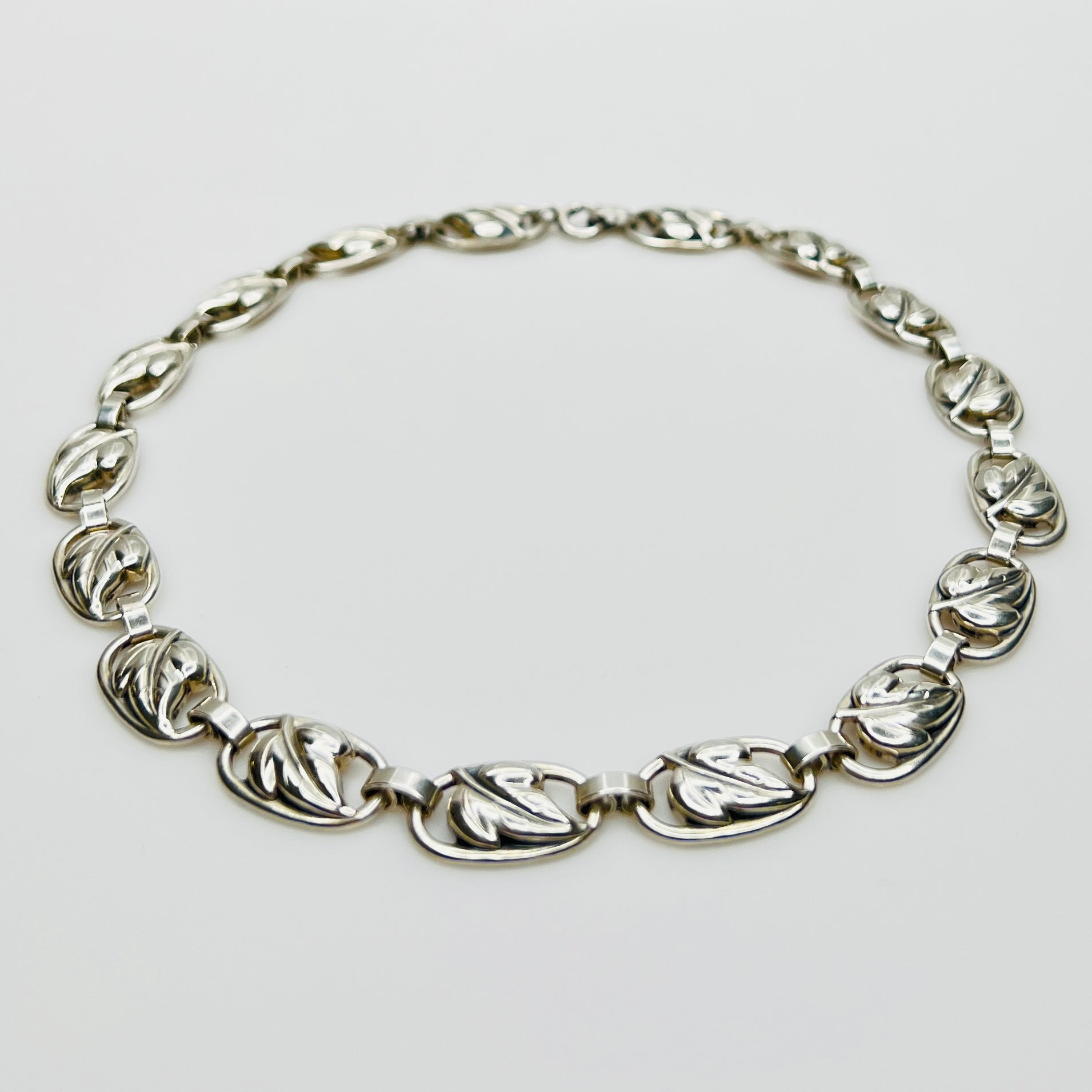 Close up sterling silver leaf link necklace detail