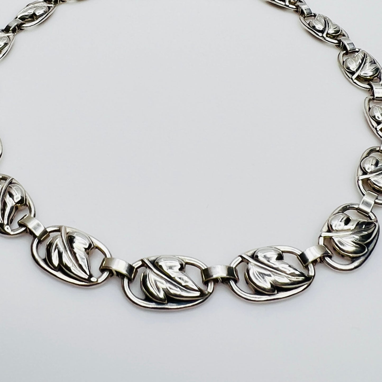 Close up sterling silver leaf link necklace detail