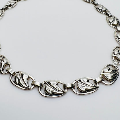 Close up sterling silver leaf link necklace detail