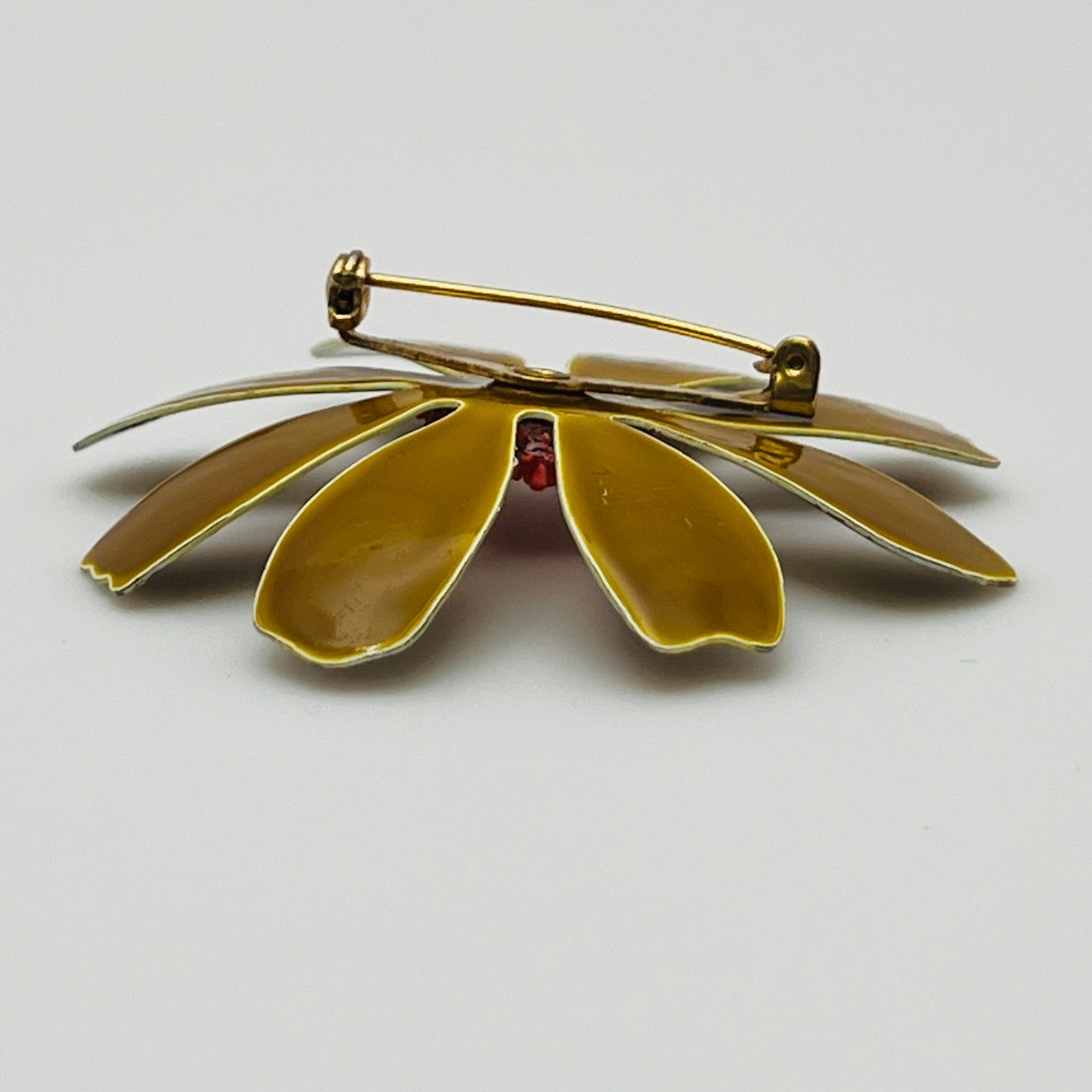 Back view of brooch with metal hardware details