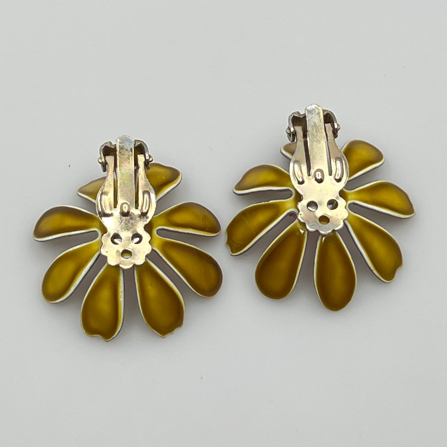 Back view of earrings with metal hardware details