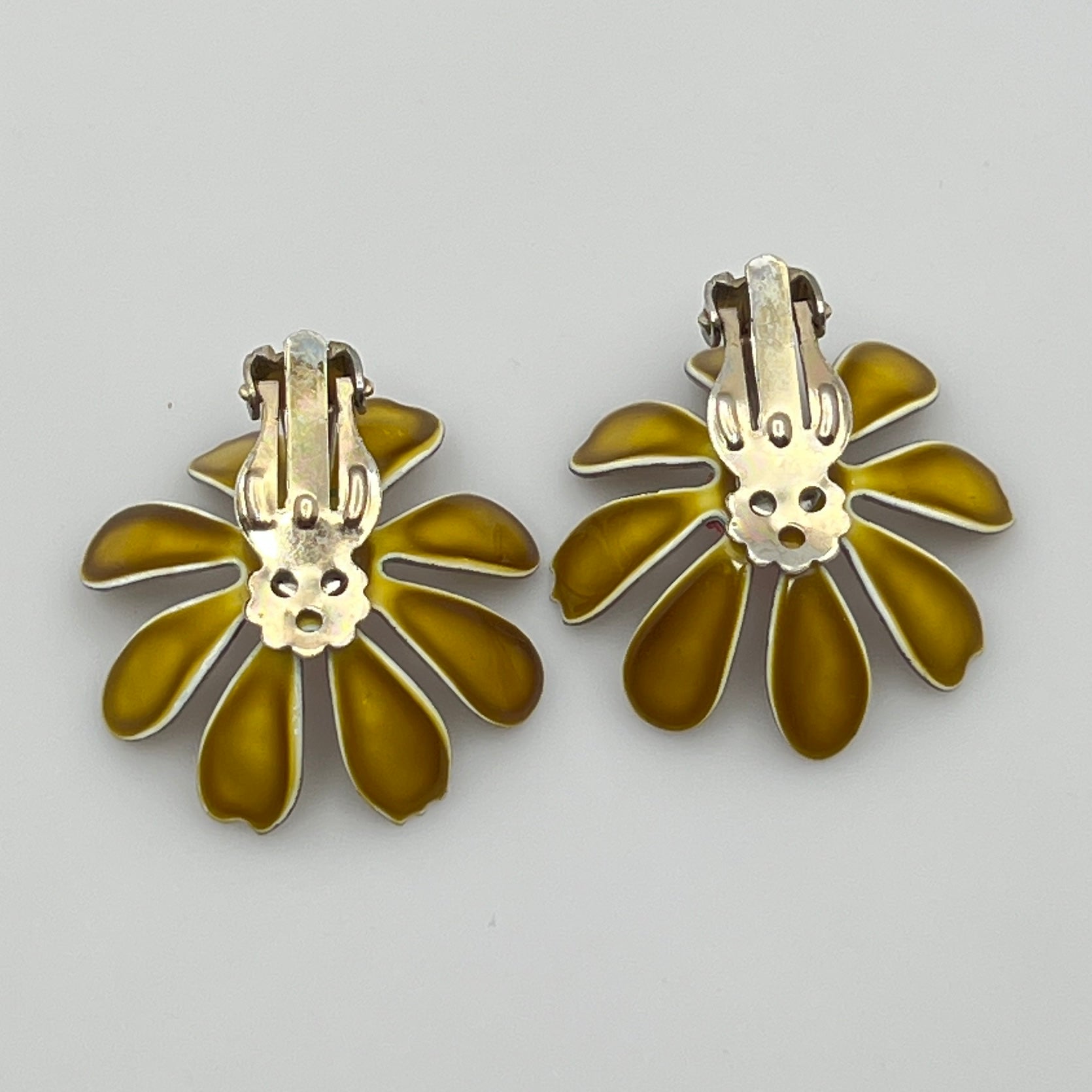 Back view of earrings with metal hardware details