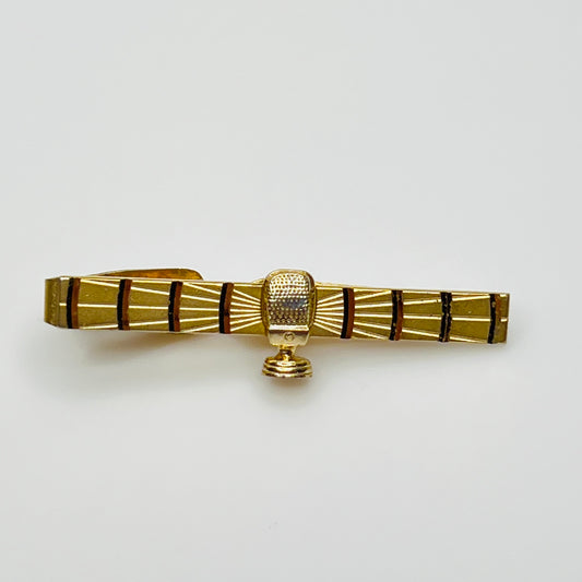 1950s gold-tone tie clip with vintage microphone motif