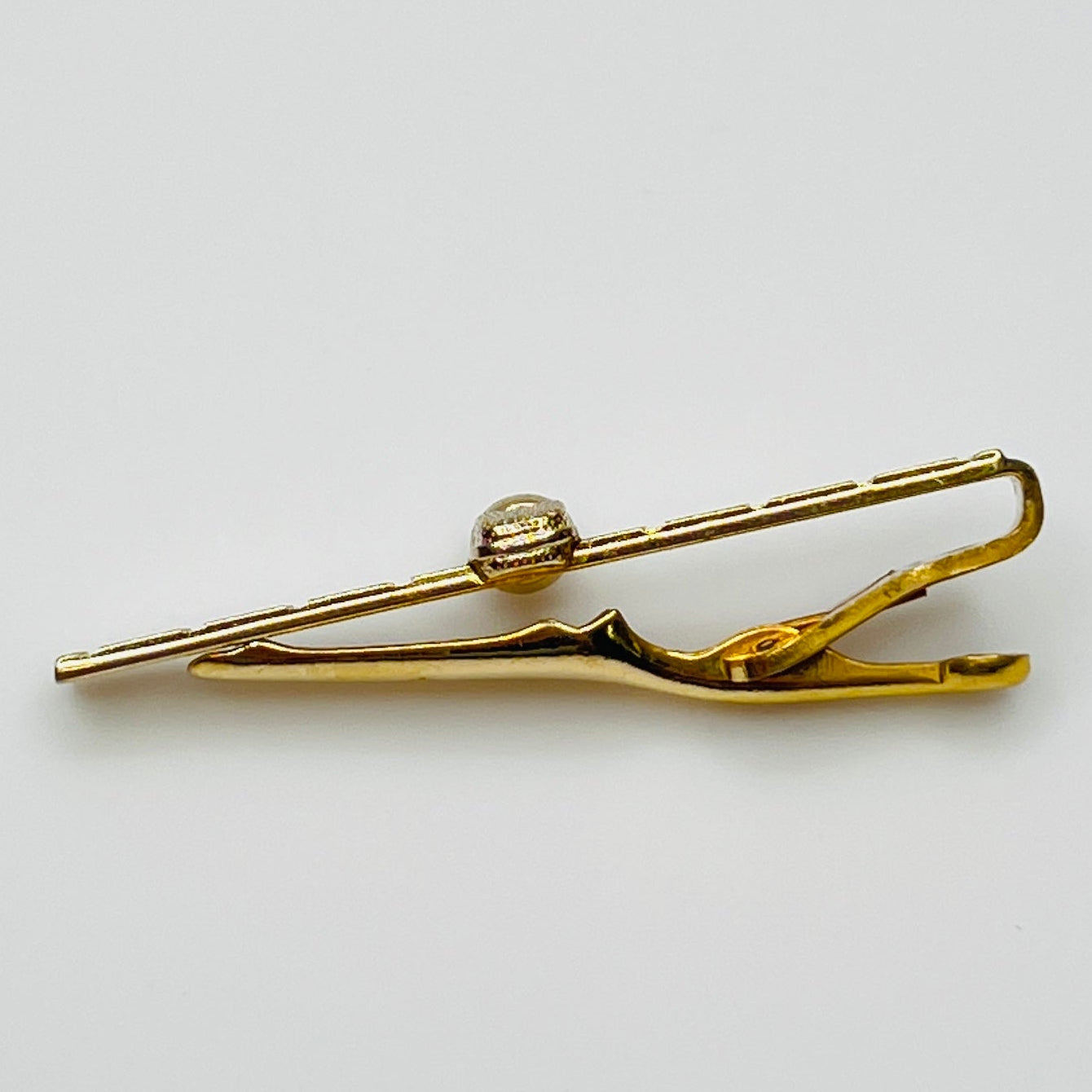 side view 1950s gold-tone tie clip with vintage microphone motif