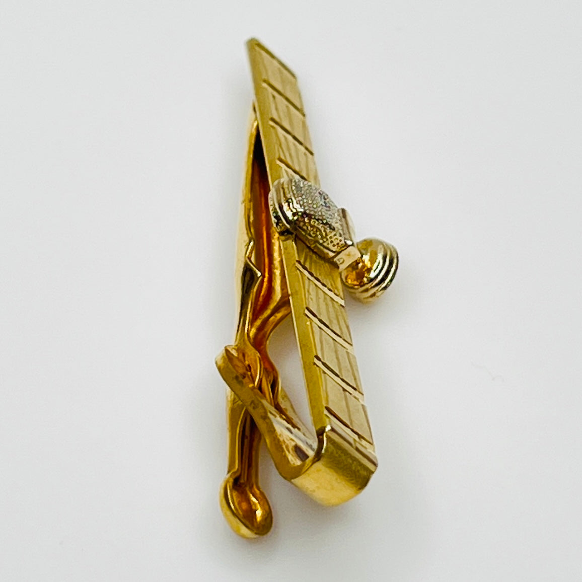 side view 1950s gold-tone tie clip with vintage microphone motif