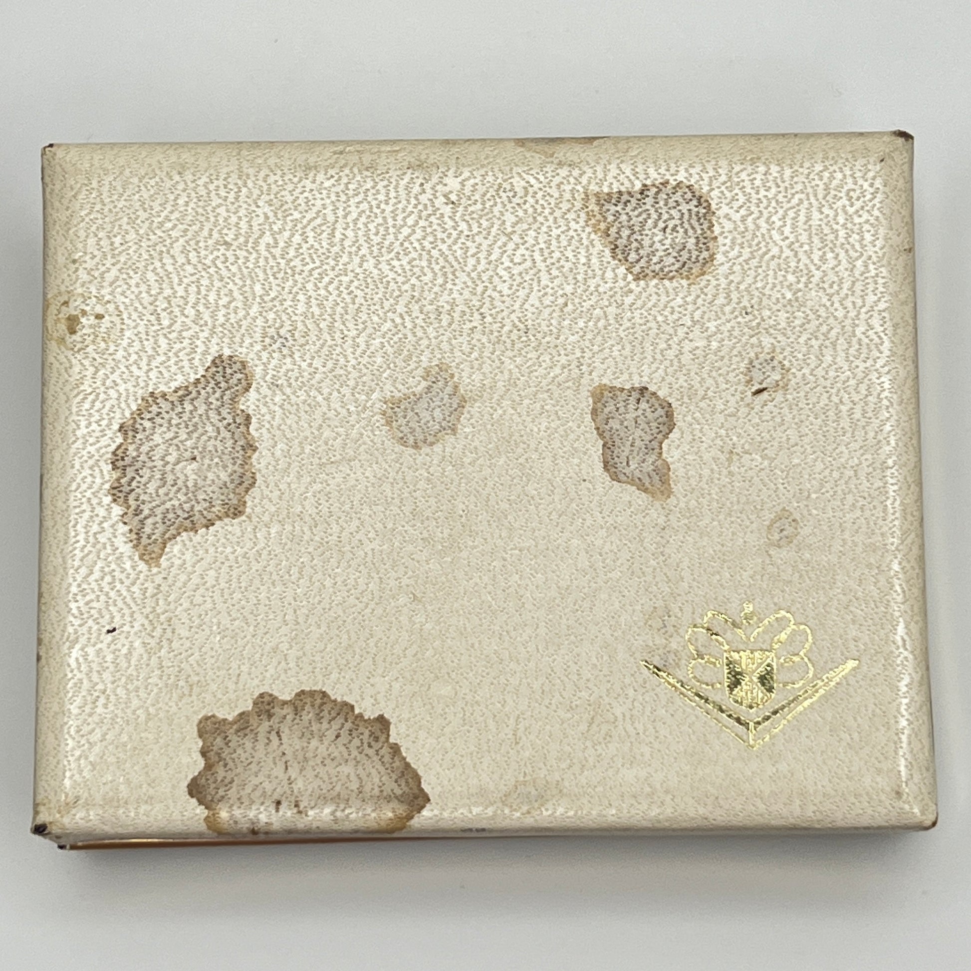 Exterior of vintage Foster box showing staining and wear