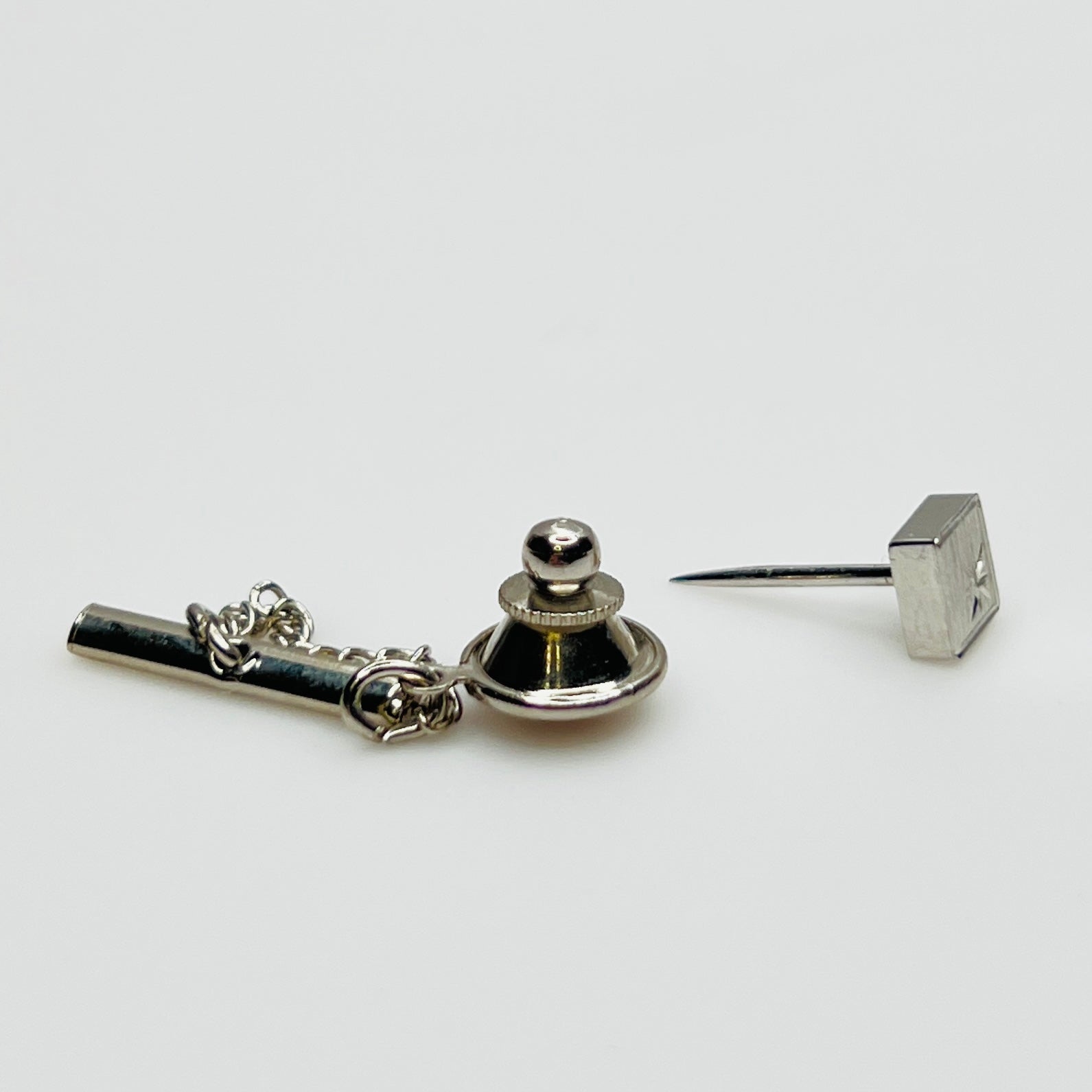 1950s Foster tie tack set with starburst engraving