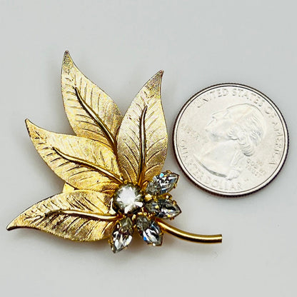 Vintage leaf brooch with quarter for scale and crystal center cluster