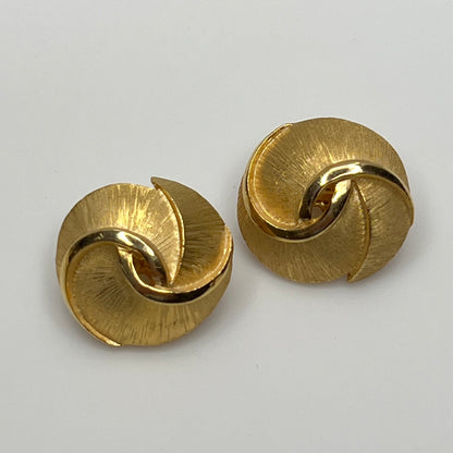 Crown Trifari gold-tone clip-on earrings with swirl design, brushed and polished finish