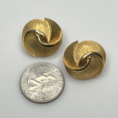 Crown Trifari gold-tone clip-on earrings with swirl design, brushed and polished finish