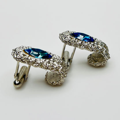Side view of vintage cufflinks showing bullet back closure