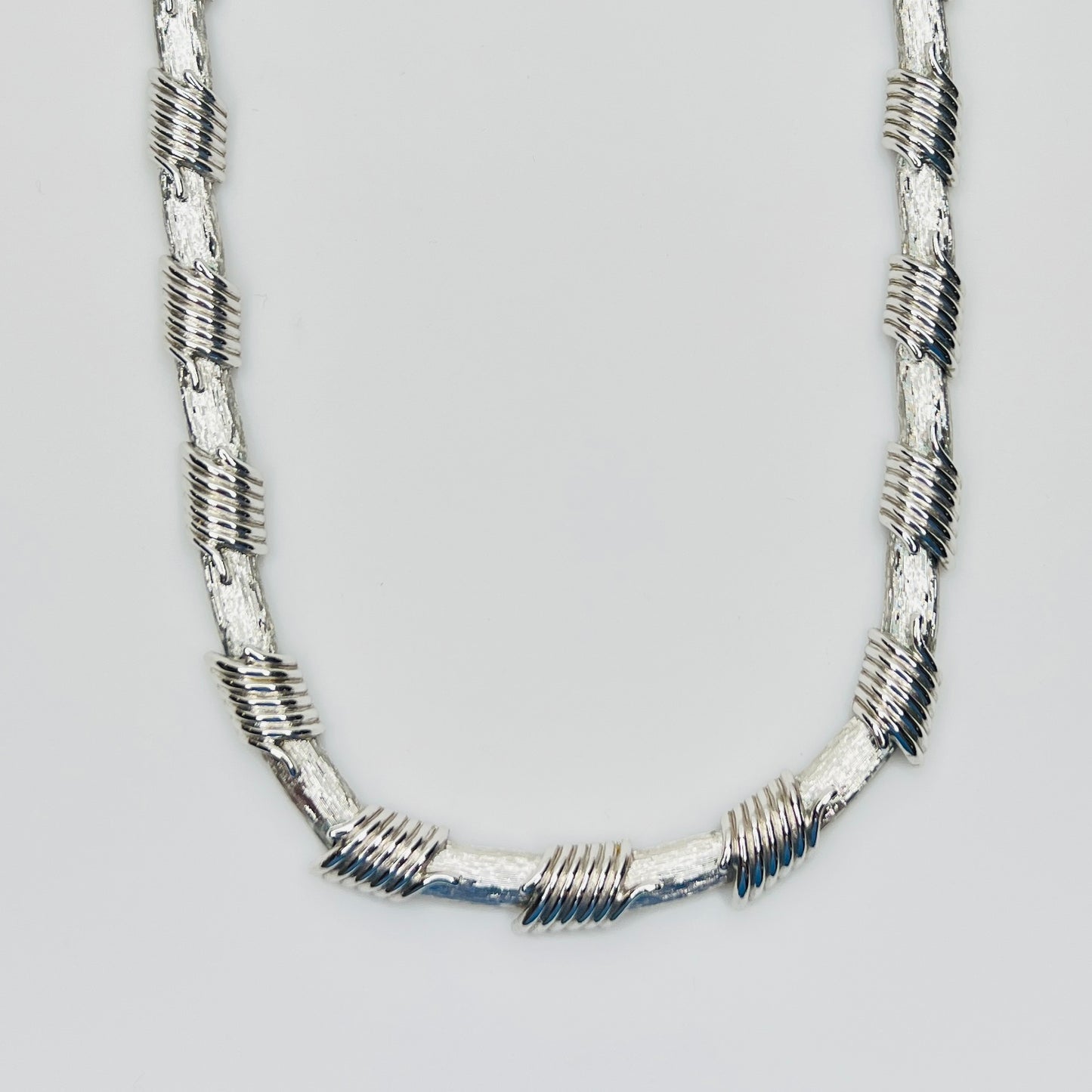 Vintage Monet silver tone wrapped link choker necklace close-up