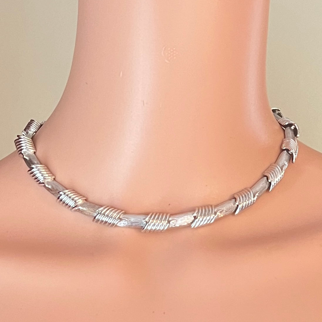 Vintage 1950s Monet silver tone choker necklace worn on mannequin