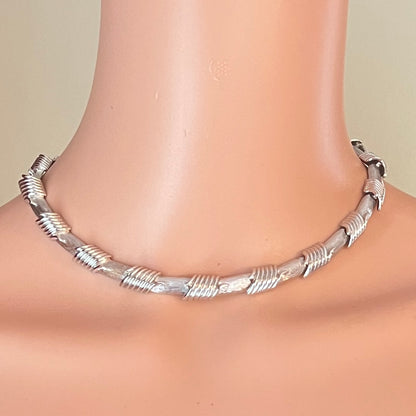 Vintage 1950s Monet silver tone choker necklace worn on mannequin