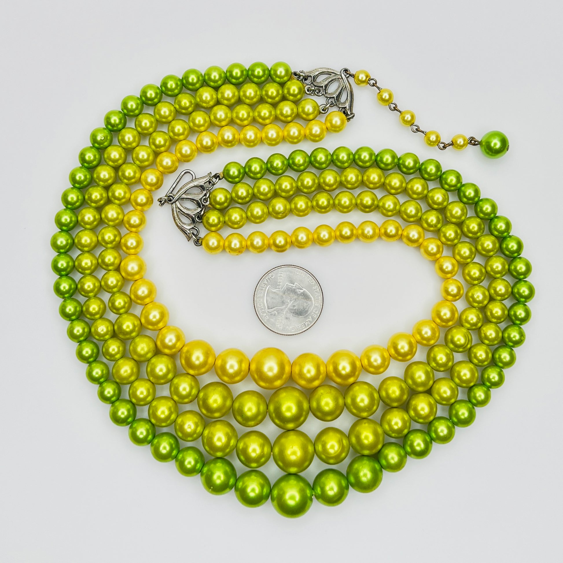 Multi strand acrylic pearl necklace with silver tone clasp