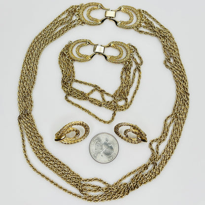 Three-piece vintage gold chain jewelry set with necklace, bracelet, and earrings