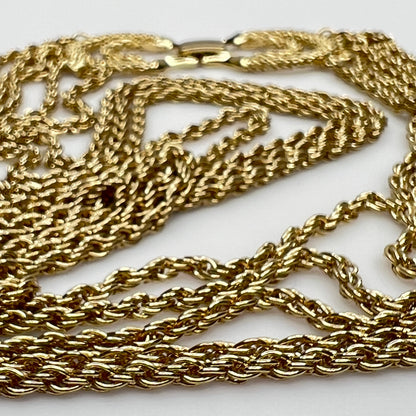 close up of gold tone chain of necklace and bracelet