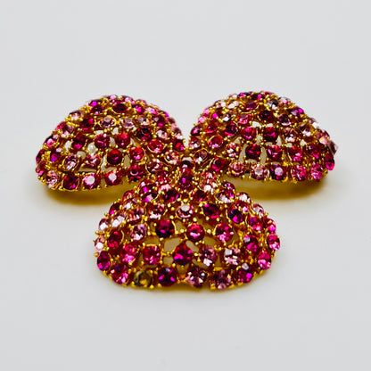 Vintage gold-tone brooch and clip-on earrings with pink rhinestones, mid-century jewelry set