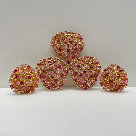 Vintage gold-tone brooch and clip-on earrings with pink rhinestones, mid-century jewelry set