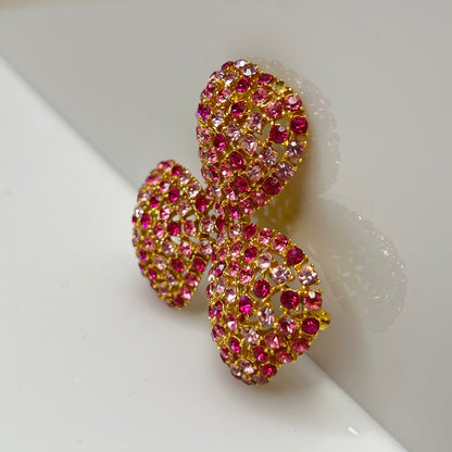 Vintage gold-tone brooch and clip-on earrings with pink rhinestones, mid-century jewelry set