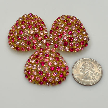 Vintage gold-tone brooch and clip-on earrings with pink rhinestones, mid-century jewelry set
