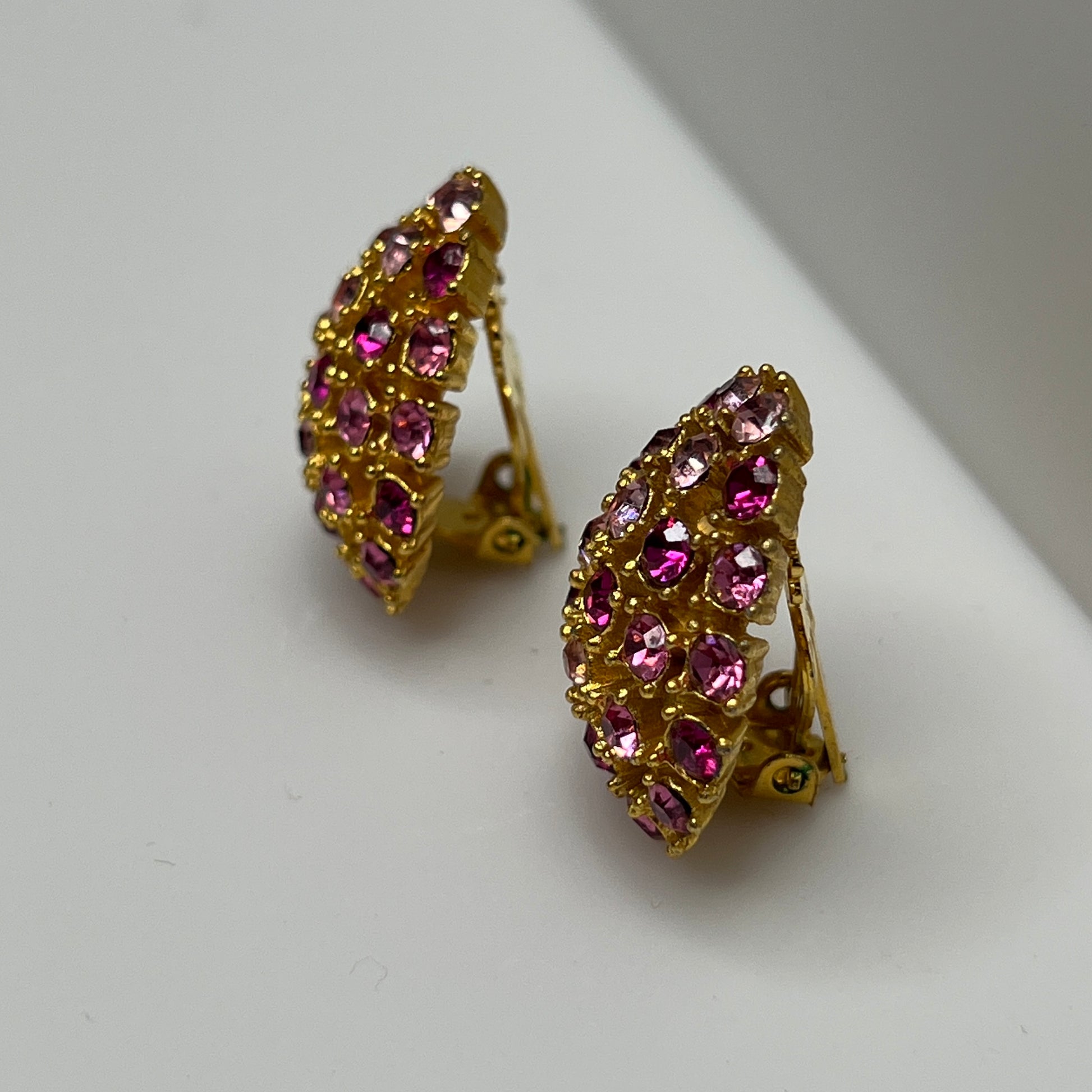 Vintage gold-tone brooch and clip-on earrings with pink rhinestones, mid-century jewelry set