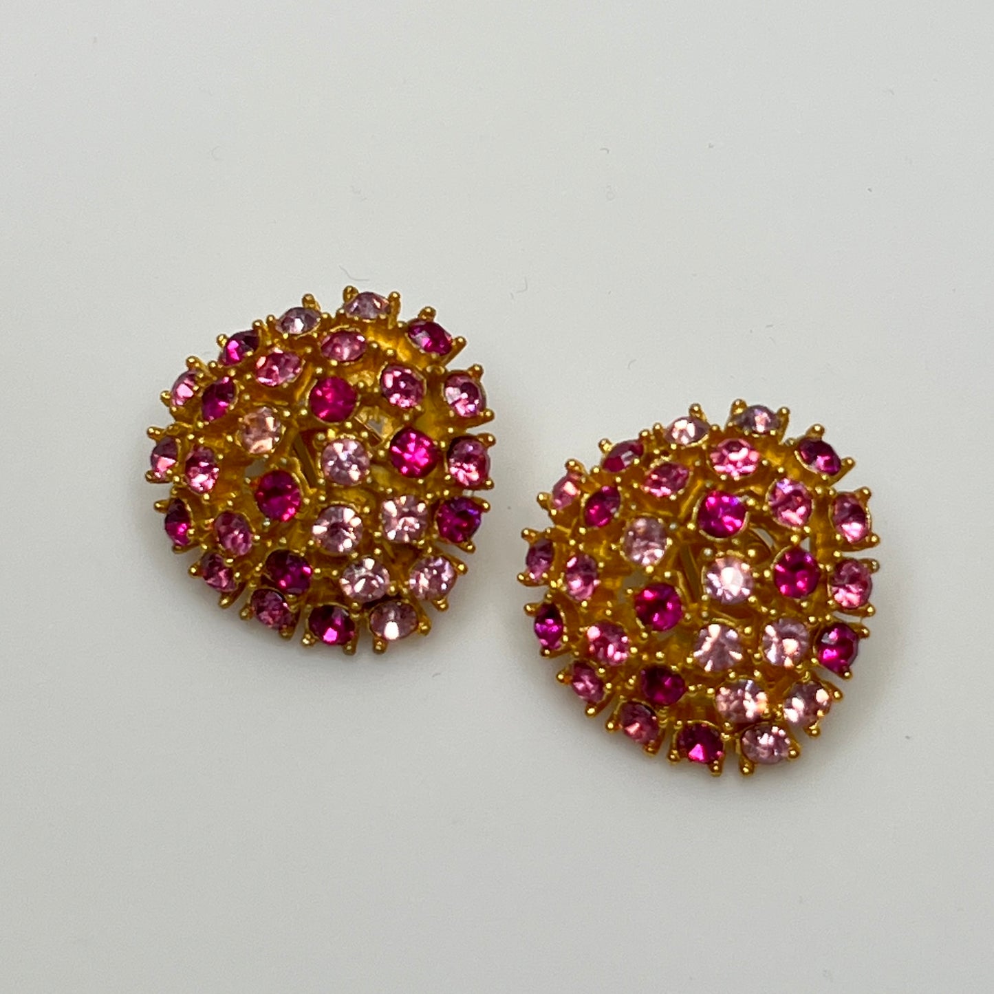 Vintage gold-tone brooch and clip-on earrings with pink rhinestones, mid-century jewelry set