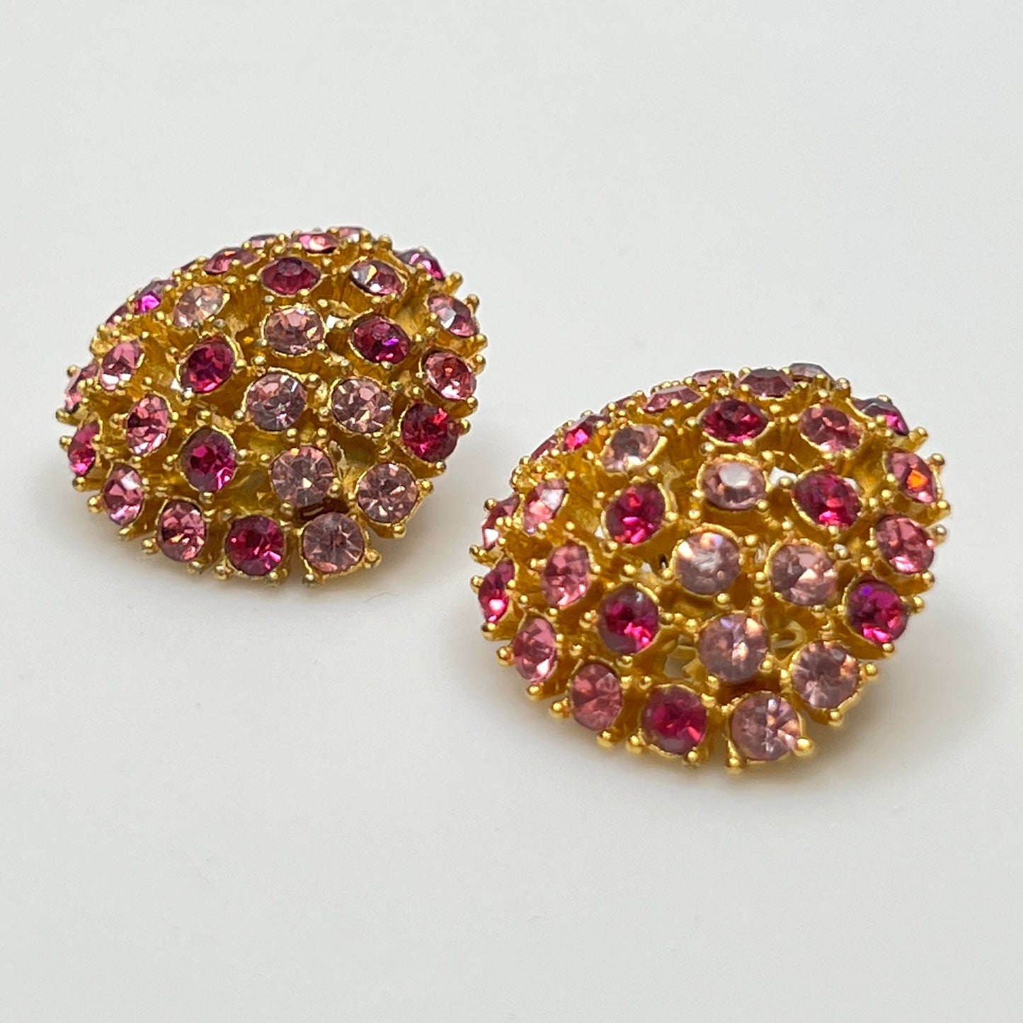 Vintage gold-tone brooch and clip-on earrings with pink rhinestones, mid-century jewelry set
