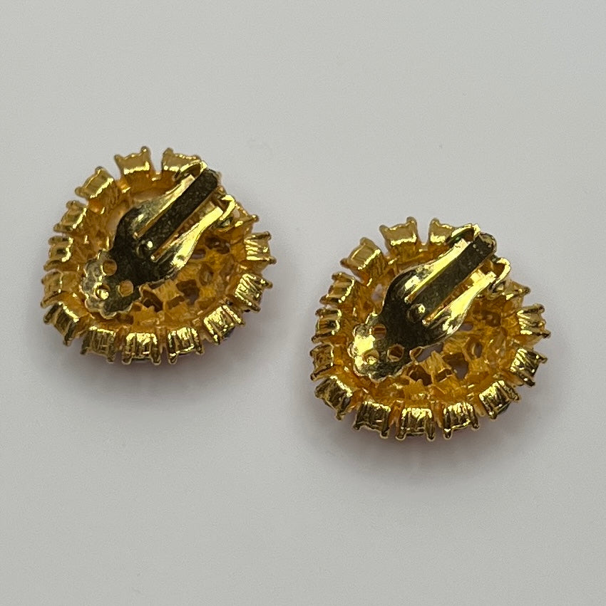 Vintage gold-tone brooch and clip-on earrings with pink rhinestones, mid-century jewelry set