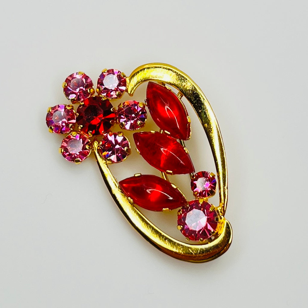 1960s Austrian crystal flower brooch with red and pink rhinestones