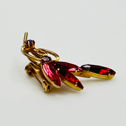 1950s pink rhinestone brooch with gold-tone spiral and navette stones