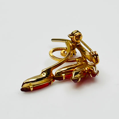 1950s pink rhinestone brooch with gold-tone spiral and navette stones