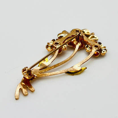 back view of vintage flower brooch with purple rhinestones and bouquet styling