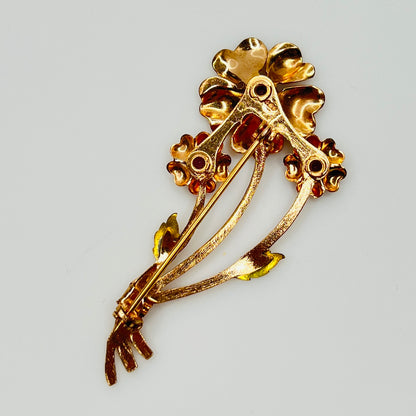 Back view of vintage flower brooch with purple rhinestones and bouquet styling
