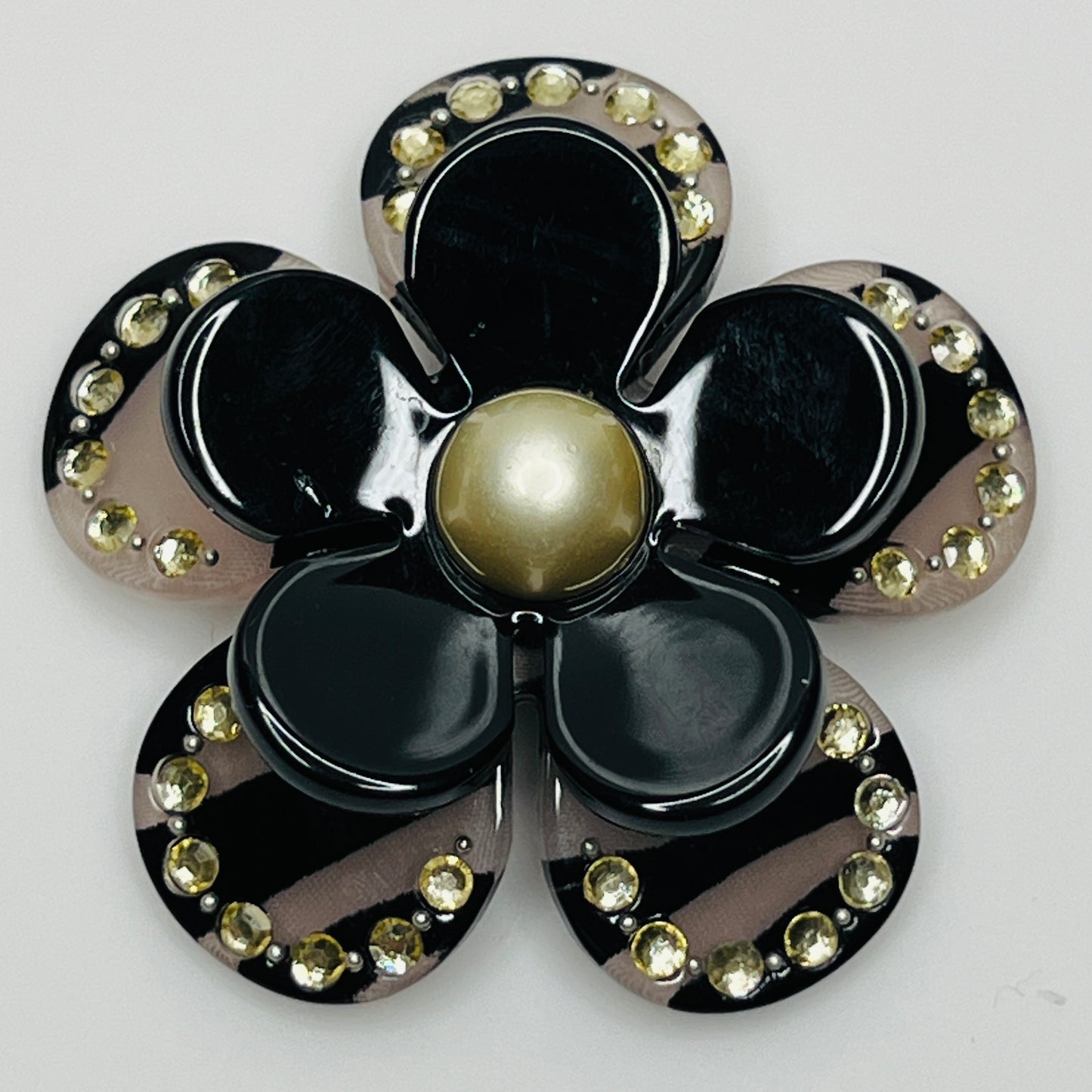 Retro black petal brooch with rhinestone detailing and pin-back